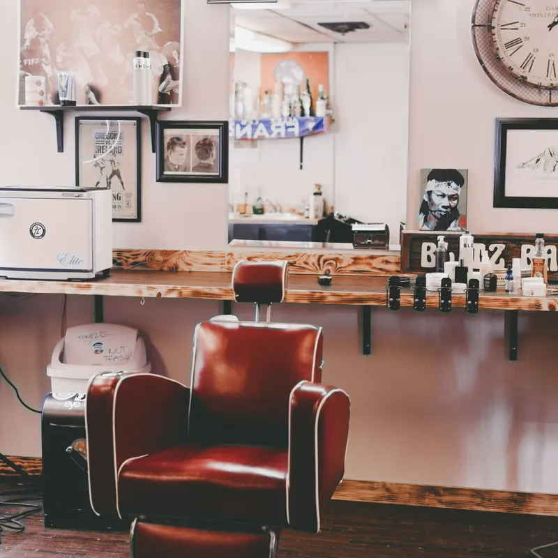 Empty, clean barbershop chair and station